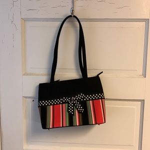 Pretty zippered purse with inside pockets. 31 brand? black & pink, cute bow!